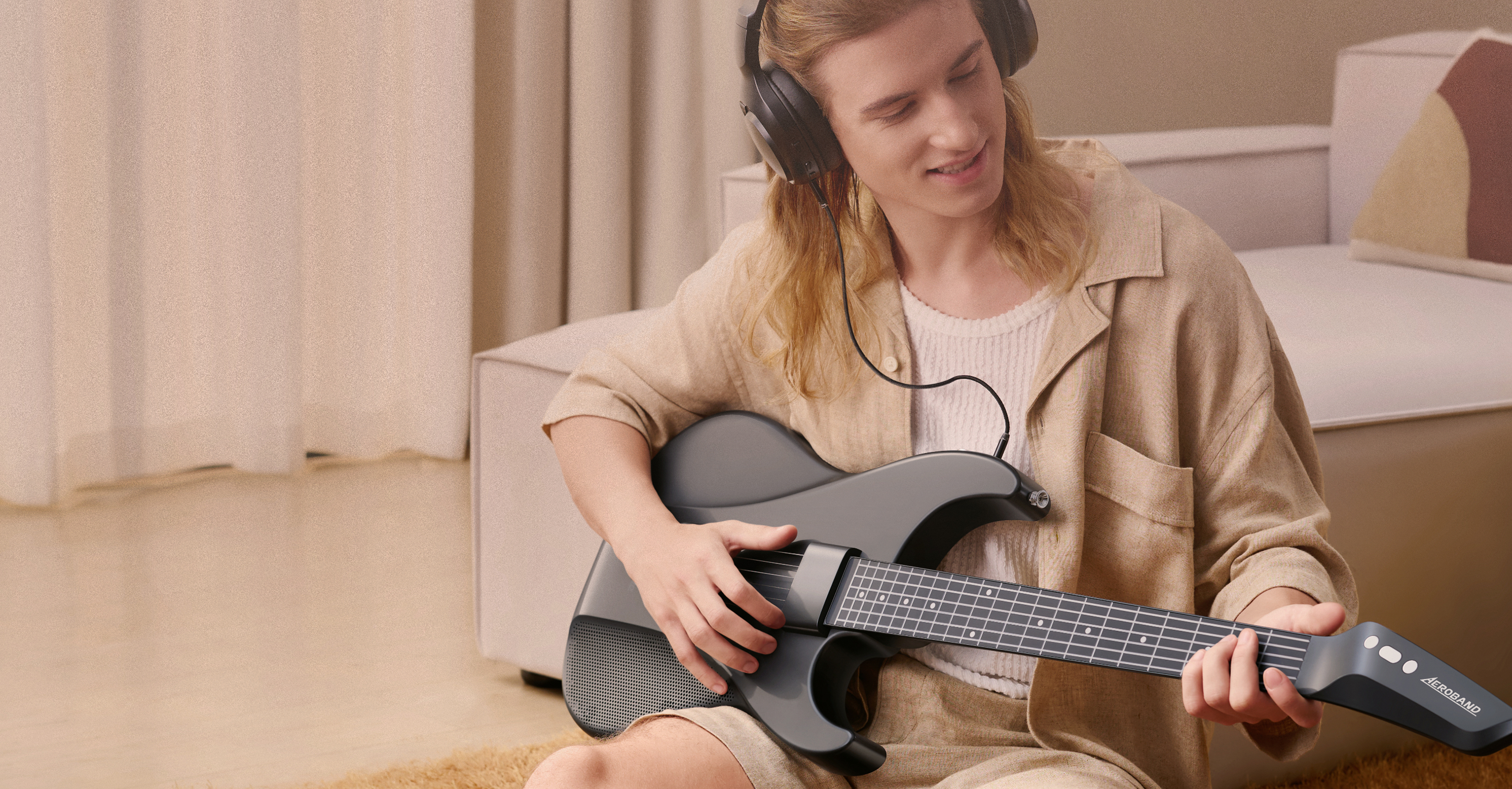 A man is playing AeroBand Guitar