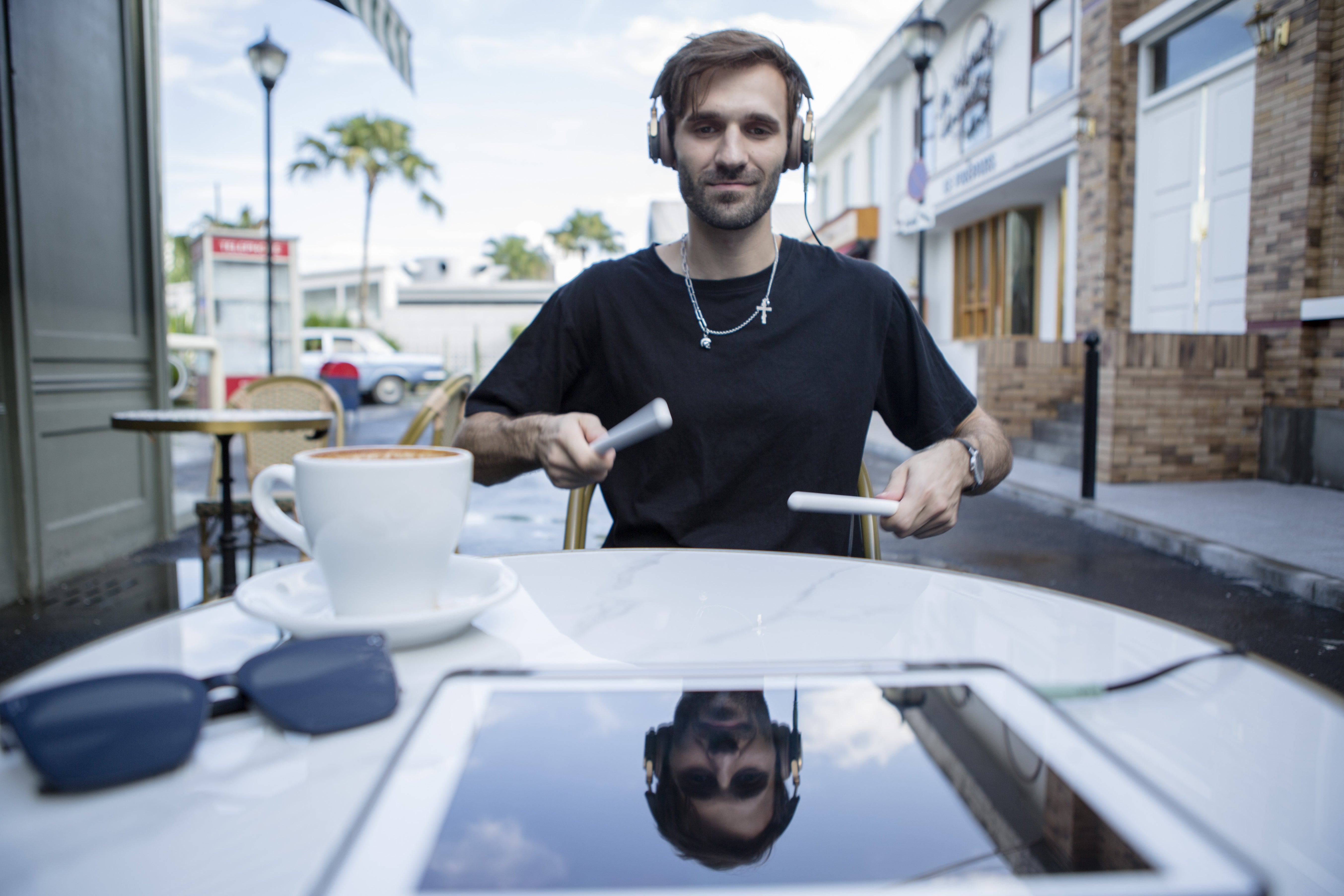 Cafe vibes and rhythm. This musician is using his PocketDrum 2 Max to practice percussion anywhere