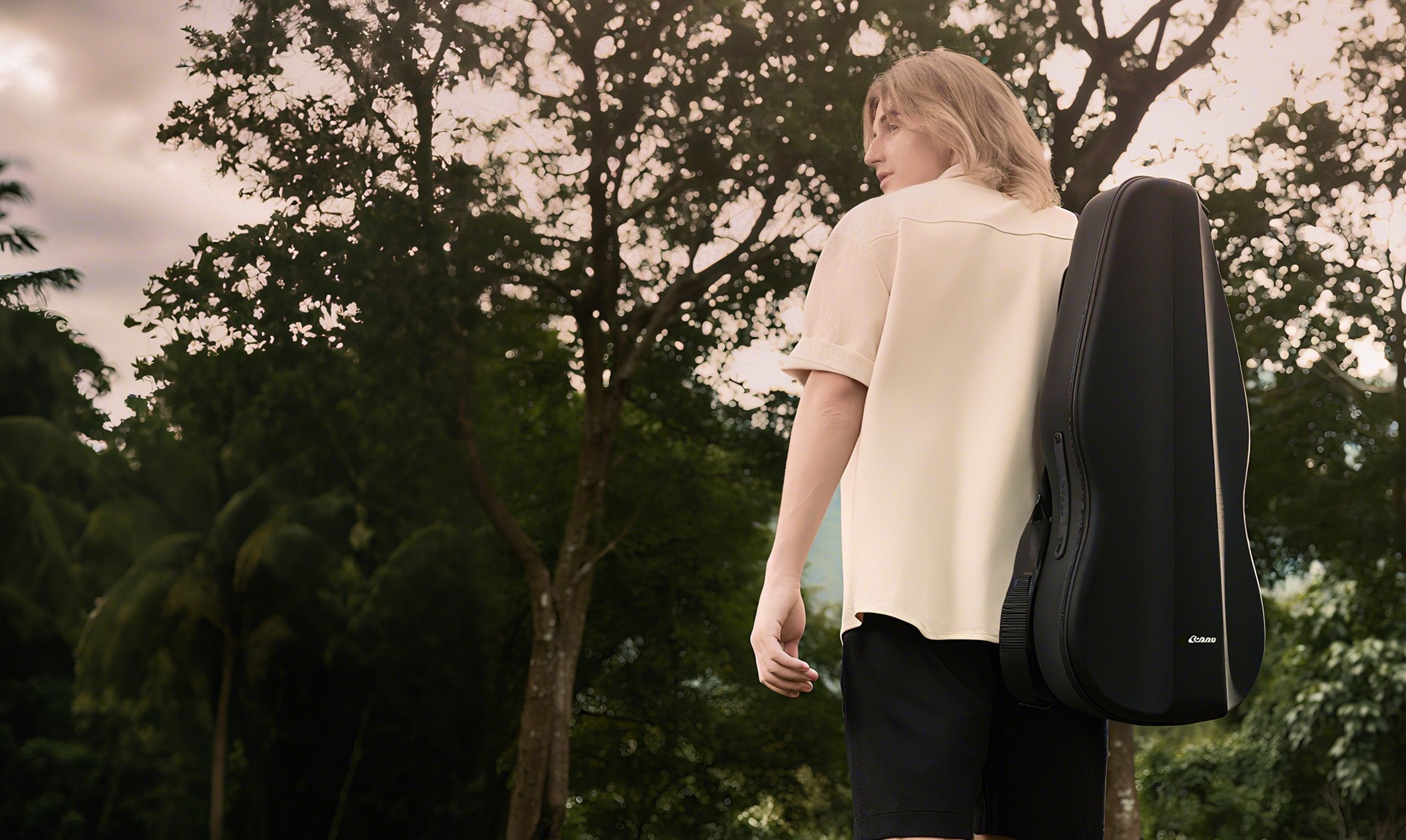 A man puts the AeroBand Guitar into his guitar case and slings it over one shoulder